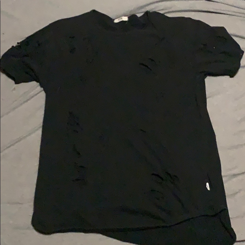 Large black ripped tee.